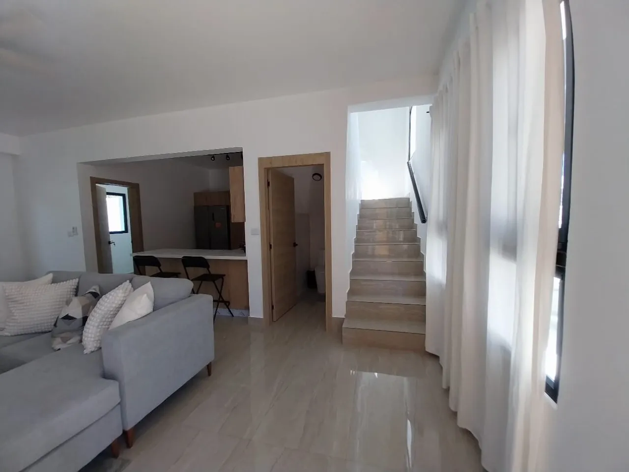 Exclusive townhouses for sale with barbecue, pool, and private beach access, 15 minutes from the airport in Punta Cana, Dominican Republic.